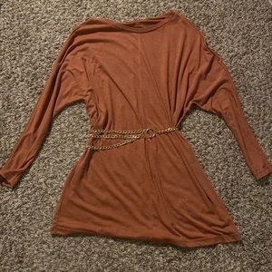 It’s a cute brown gold ish dress with an adjustable gold chain